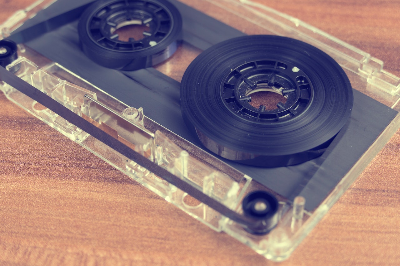 Clear and Black Cassette Tape on Brown Wooden Surface Photo by Anthony : ) from Pexels: https://www.pexels.com/photo/clear-and-black-cassette-tape-on-brown-wooden-surface-170290/